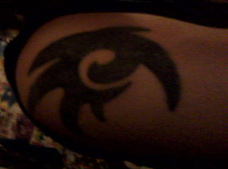 Shadow tribal symbol tattoo