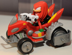 Knuckles in red buggy vehicle