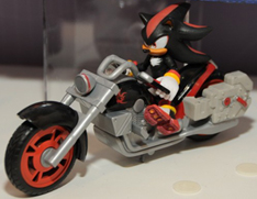 Shadow on motorcycle racer figure