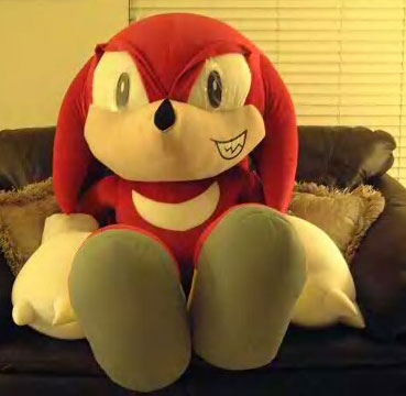Eager giant knuckles on a sofa