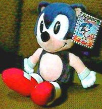 Old dark blue Sonic doll on a couch photo